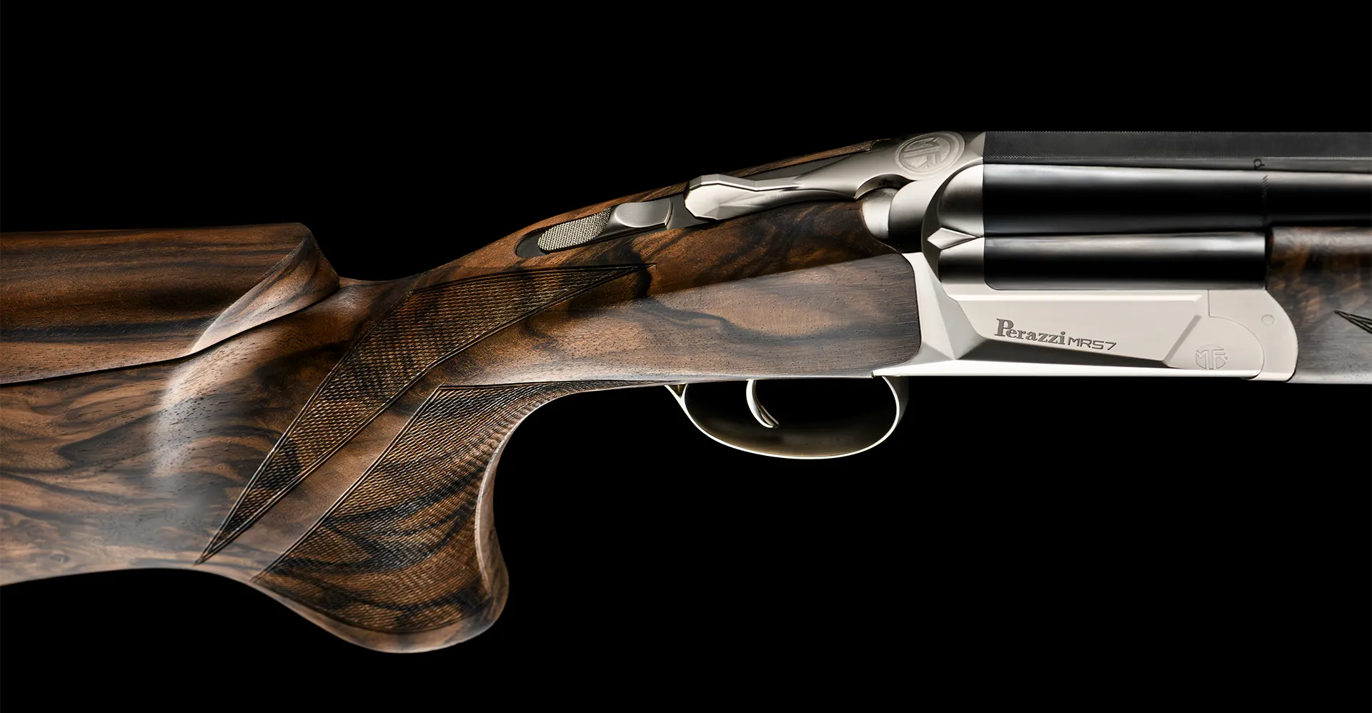 Detail of the Perazzi MR57 in walnut and polished steel